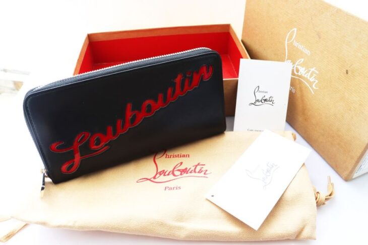 Bóp cầm tay Nữ Louboutin Da đen chữ đỏ đặc trưng ( Thương hiệu Pháp ) Like New Fullbox